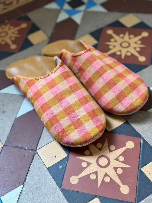 Morrocan linen Babouche artisan made slippers on tiled floor.