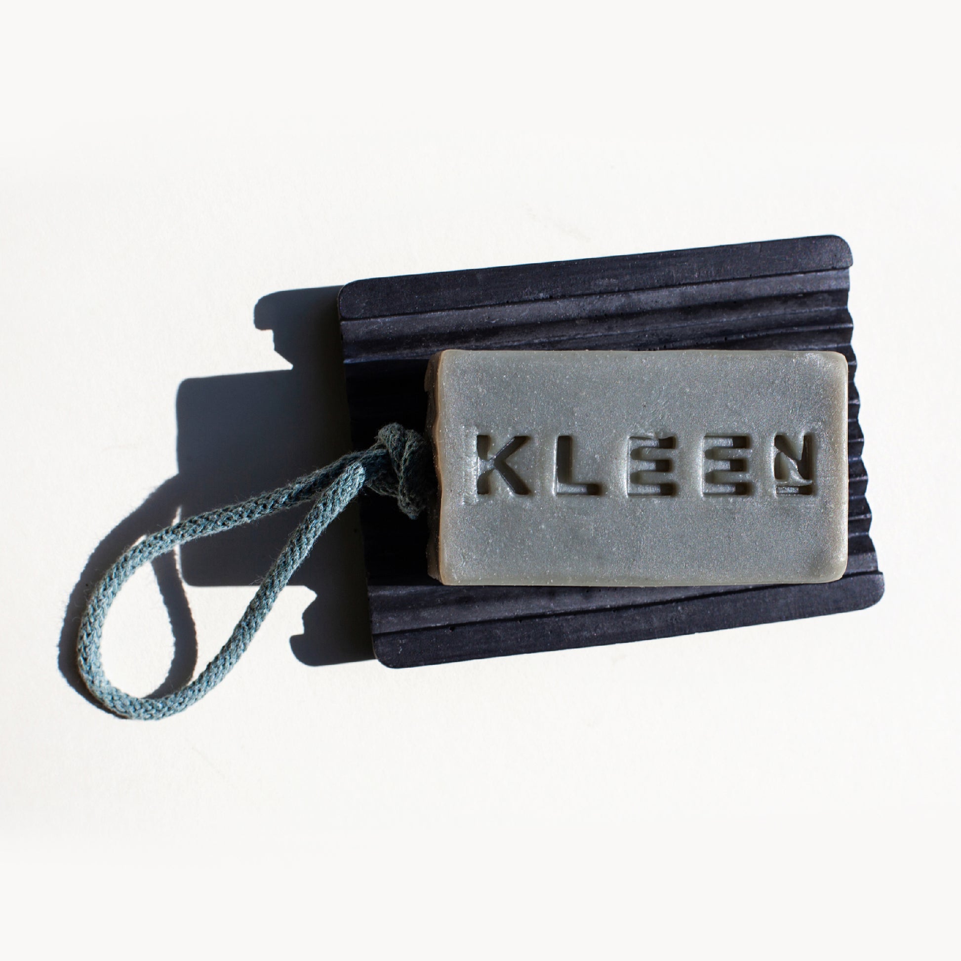 Handcrafted vegan eco-friendly soap on a rope bar on soap dish by natural skincare brand KLEEN