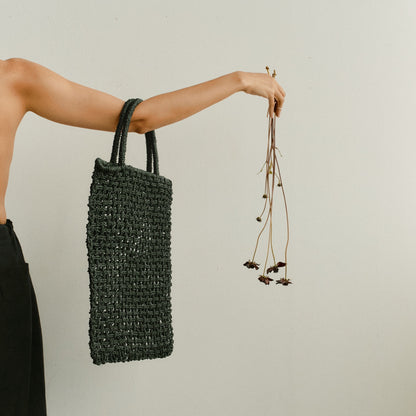 Handwoven by Uri handwoven macrame Toby bag being modelled by a female