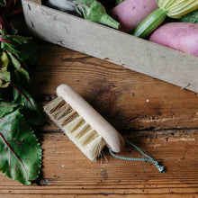 Andree Jardin Beech Wood Vegetable Brush on a wooden kitchen top with vegetables